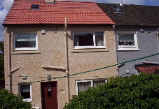Roofed house close view