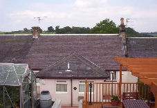 Roofed home far view
